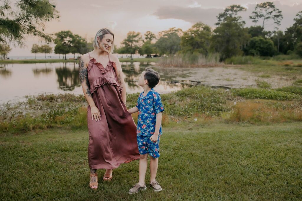 mother and son in front of a pond in mandeville louisiana