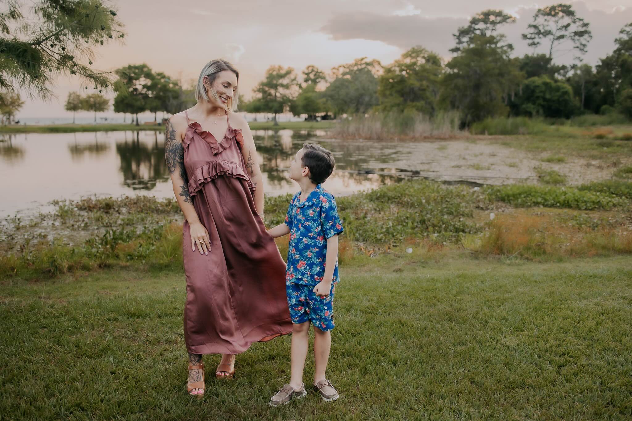 mother and son in front of a pond in mandeville louisiana