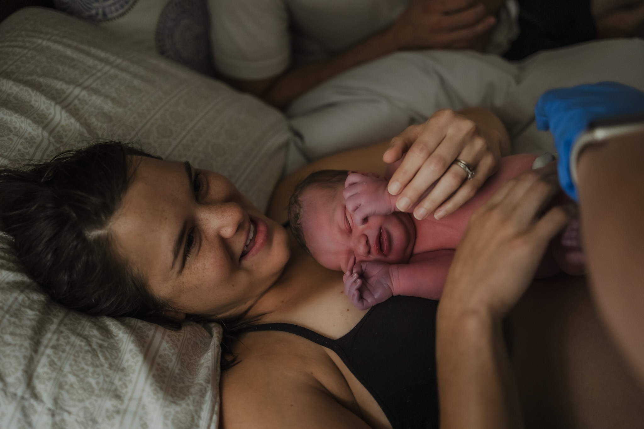 Mom cradles newborn after home birth in New Orleans