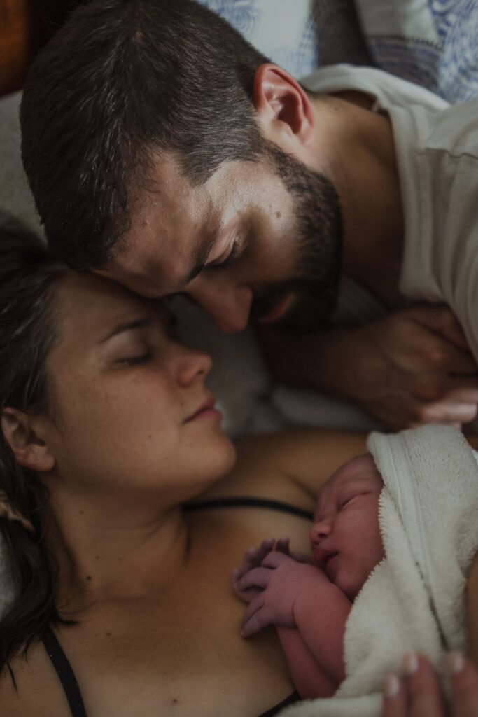 Mom and Dad share a special moment after their home birth in New Orleans